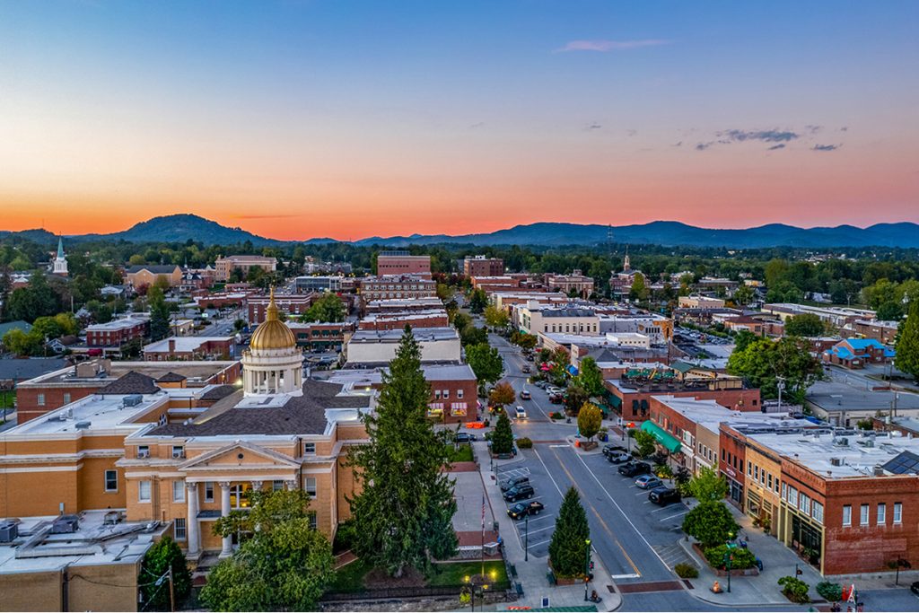 Aerial view of downtown Hendersonville NC at sunset, from The Pet Owner's Guide to Hendersonville